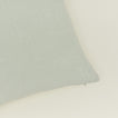 Close up view of simple linen pillow in sage