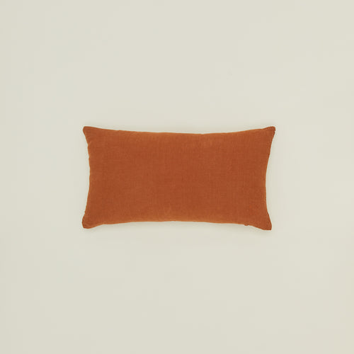 Simple linen pillow in terracotta