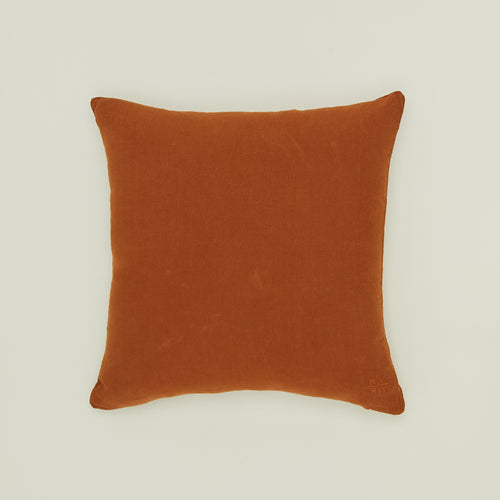 Simple linen pillow in terracotta