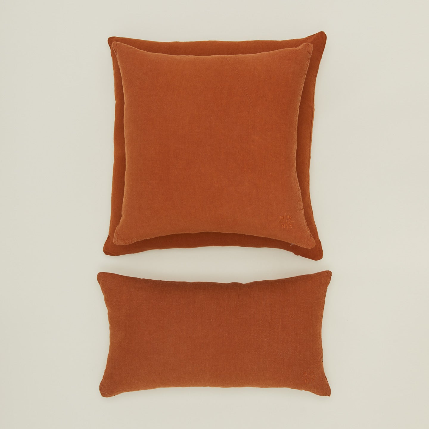 Simple linen pillow in terracotta