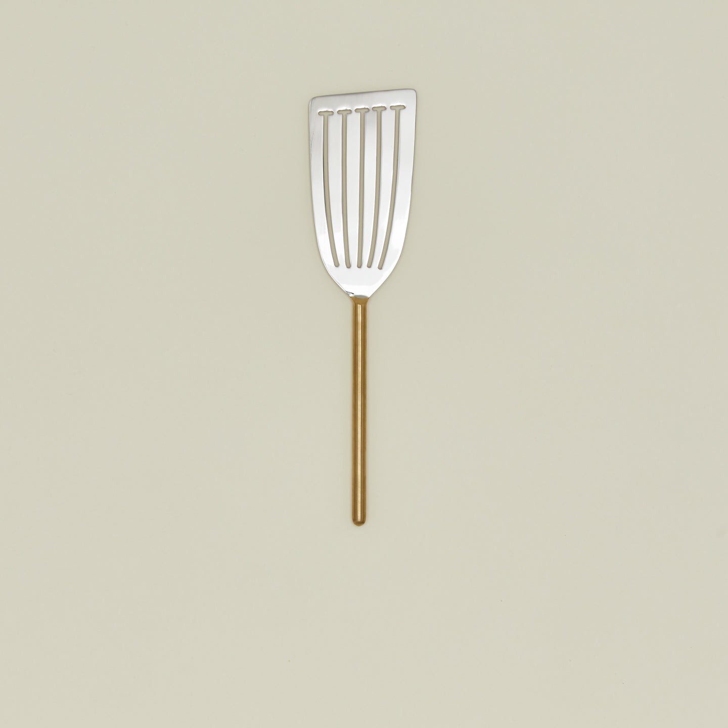 Simple metal fish spatula in brass