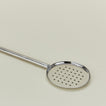 Close up view of Simple metal flat slotted spoon in silver