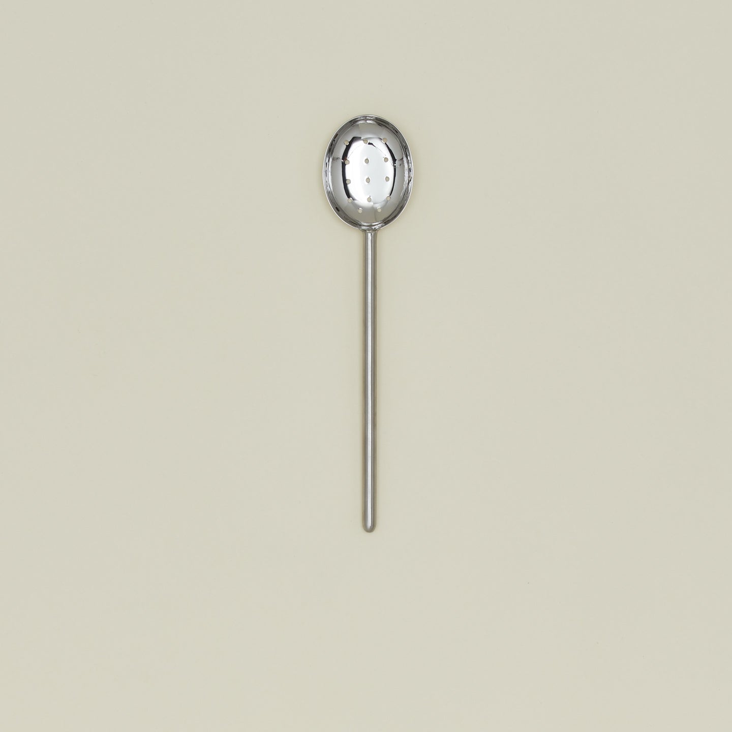 Simple metal slotted spoon in silver