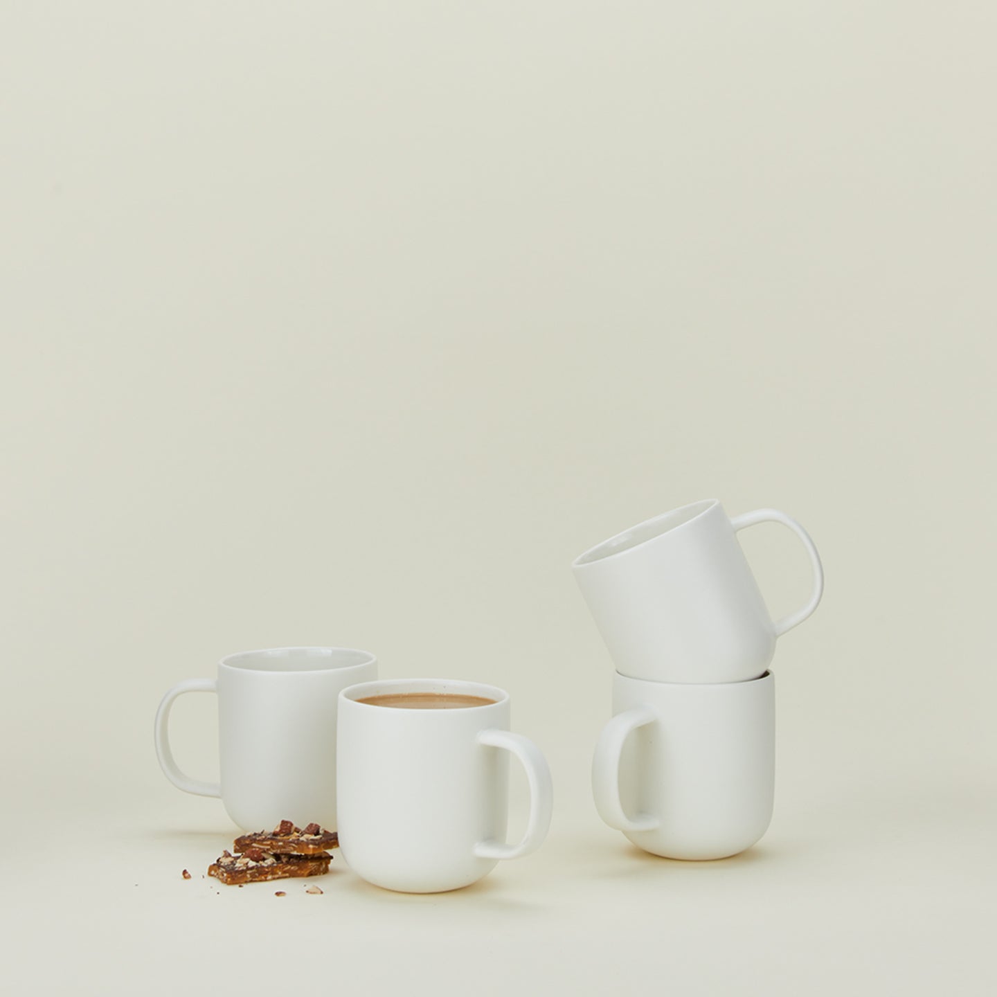 Simple porcelain mug set of 4 in white with coffee and brittle