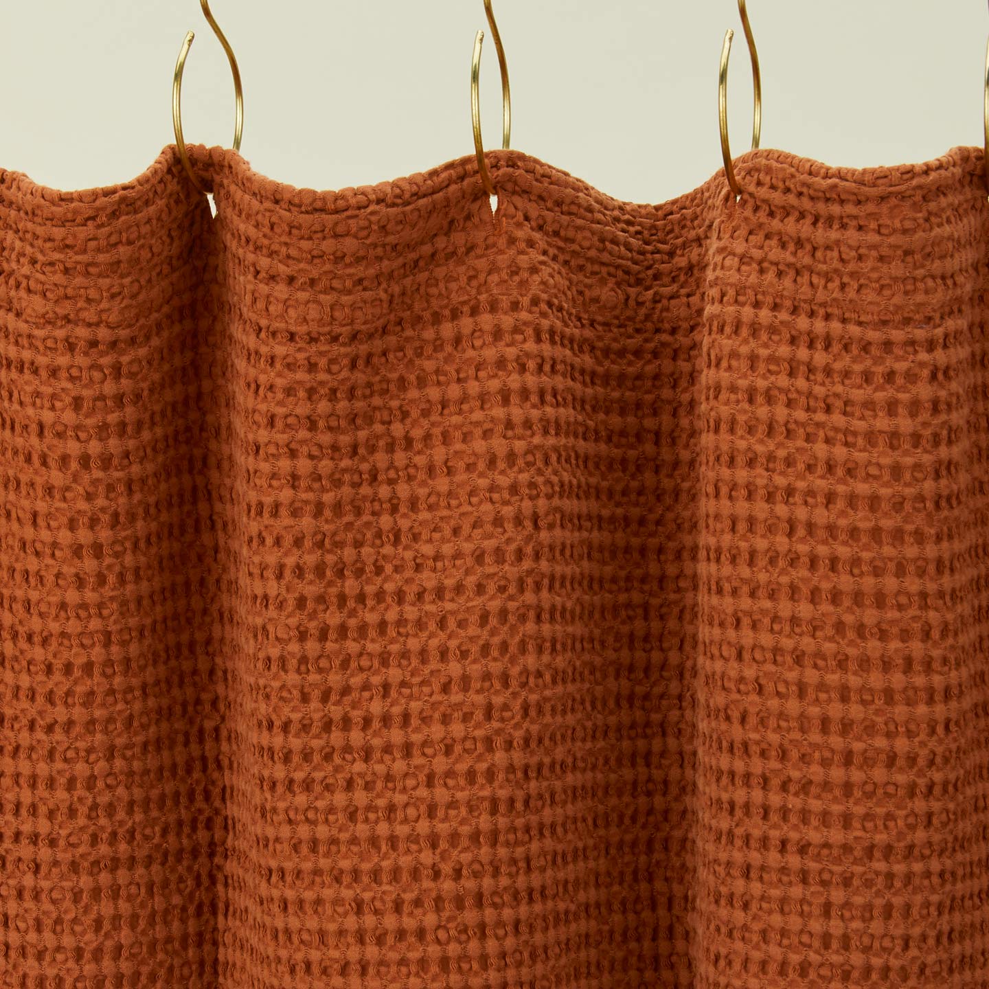 Simple waffle shower curtain in terracotta