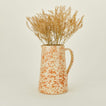 Large splatterware pitcher in ivory and bronze with florals