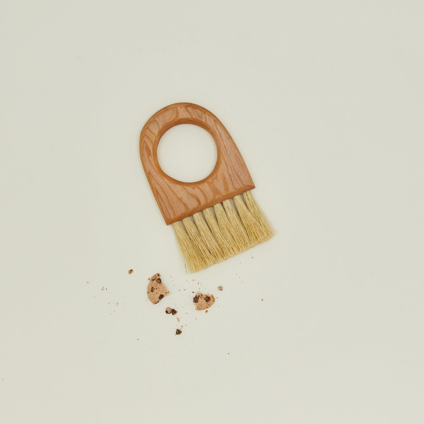 Overhead view of cherry brush with cookie crumbs