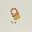 Overhead view of cherry brush with cookie crumbs