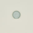 An overhead of a seafoam stoneware spoon rest.
