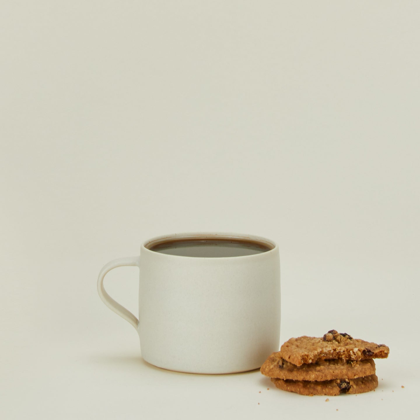 Tracie Hervy hand thrown mug with cookies and coffee