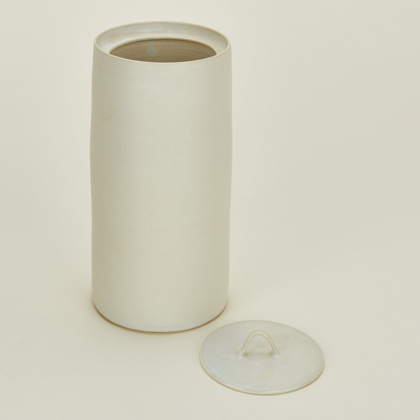 Close up view of Tracie Hervey tall lidded jar.