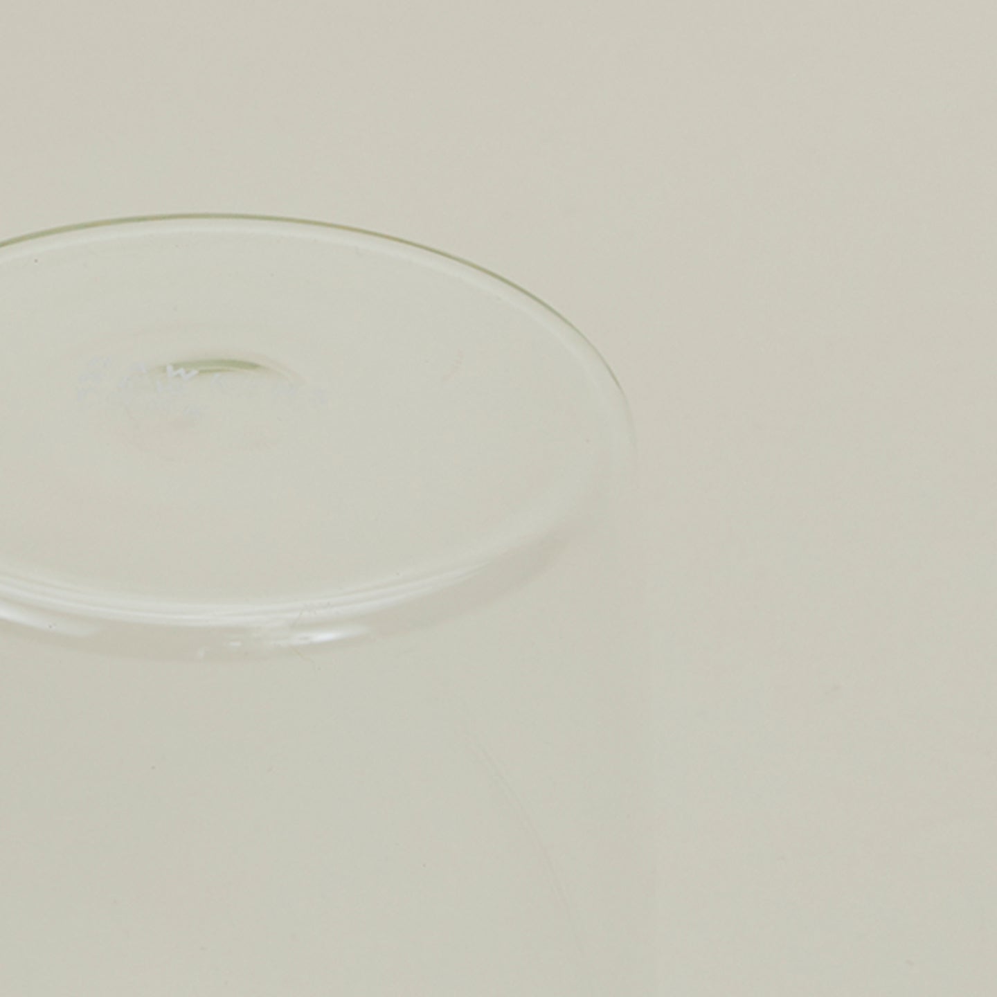 Close up of the bottom of the Essential Glass in Clear.