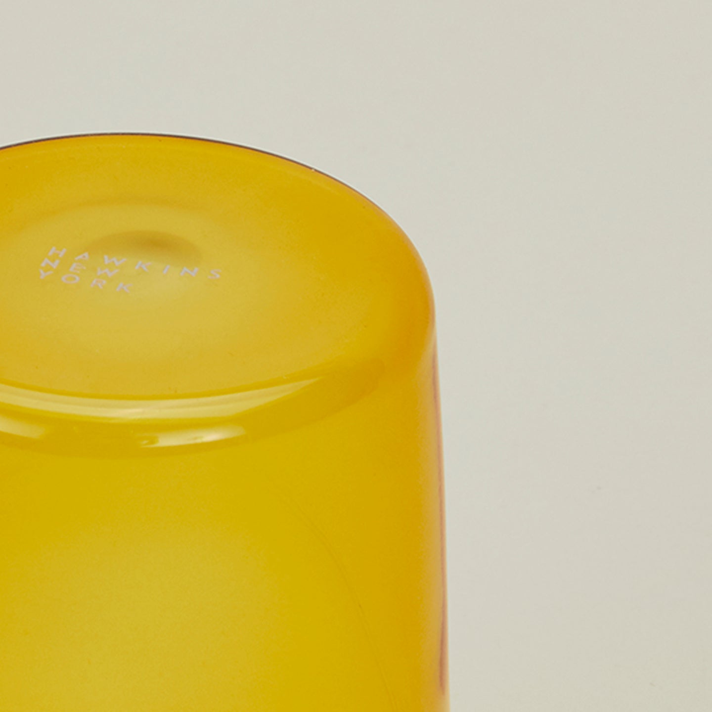 Close up of the bottom of the Essential Glass in Amber.