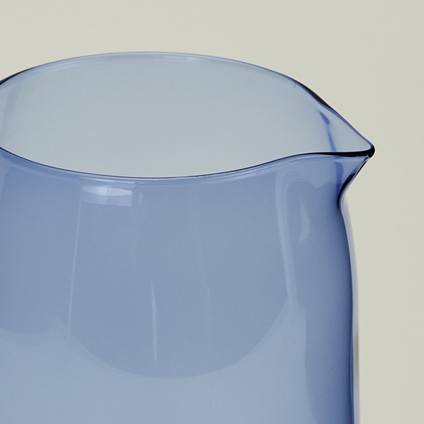 Close up of the rim of the Essential Glassware Pitcher in Blue.